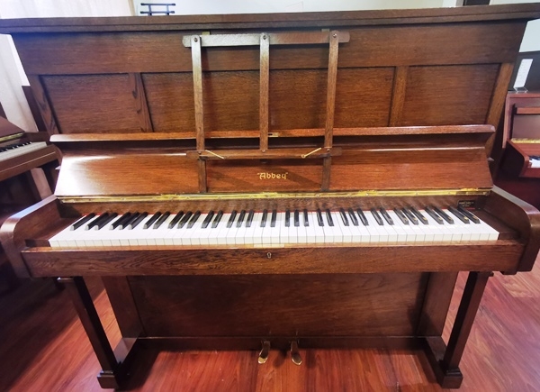 Abbey pre-owned upright piano.