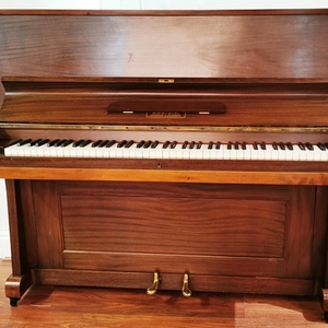 Bell pre-owned upright piano.