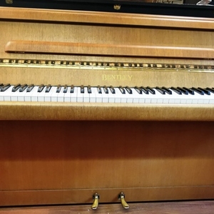 Bentley pre-owned upright piano.